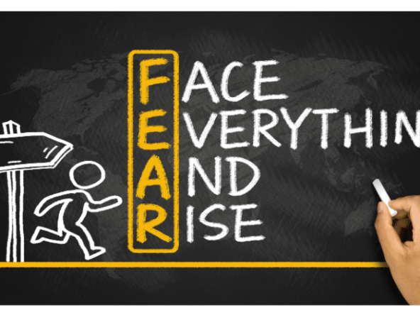 Text "face everything and rise" on blackboard, with running figure and direction board